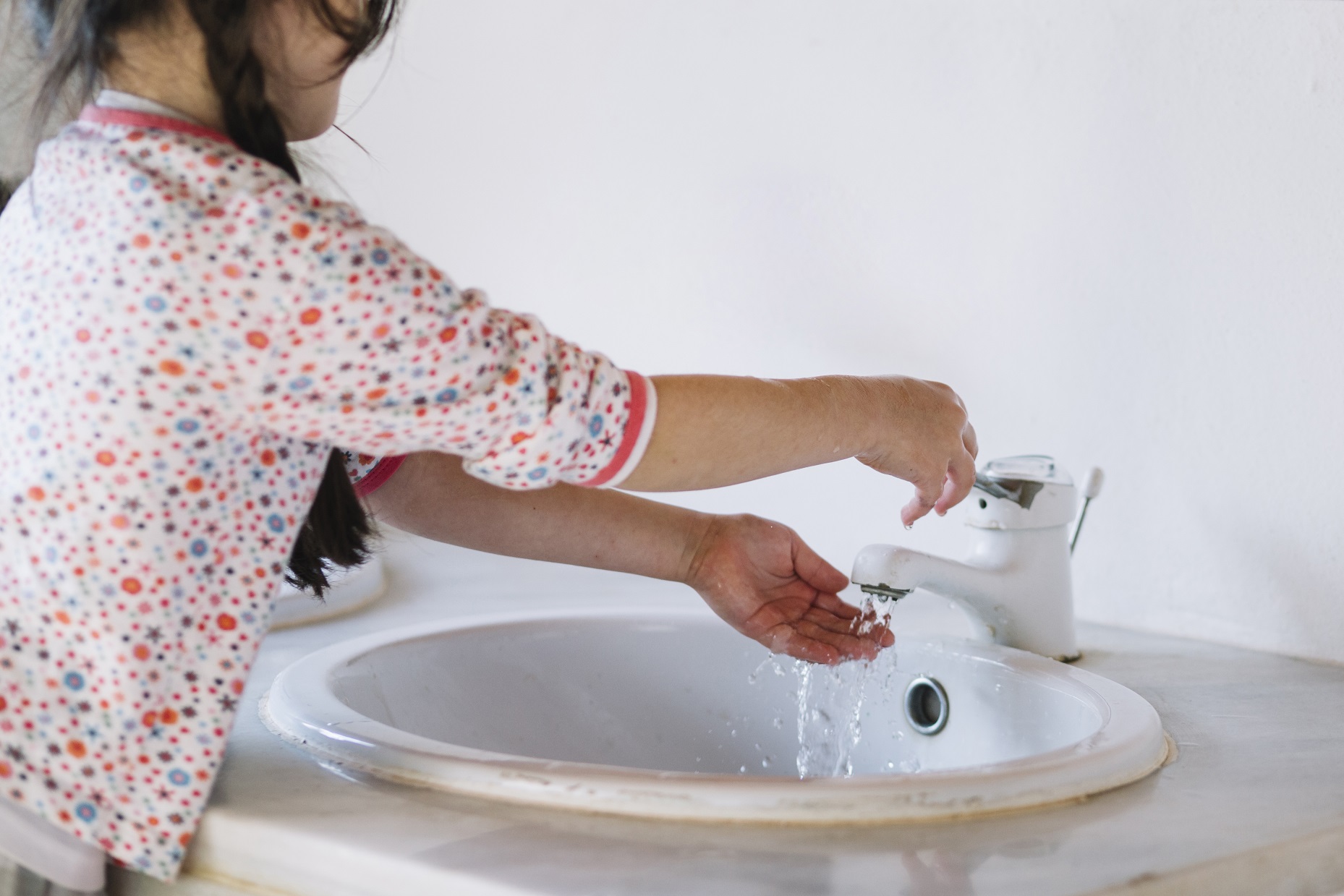 Hand, Foot & Mouth Disease (HFMD) - Little girl washing hands