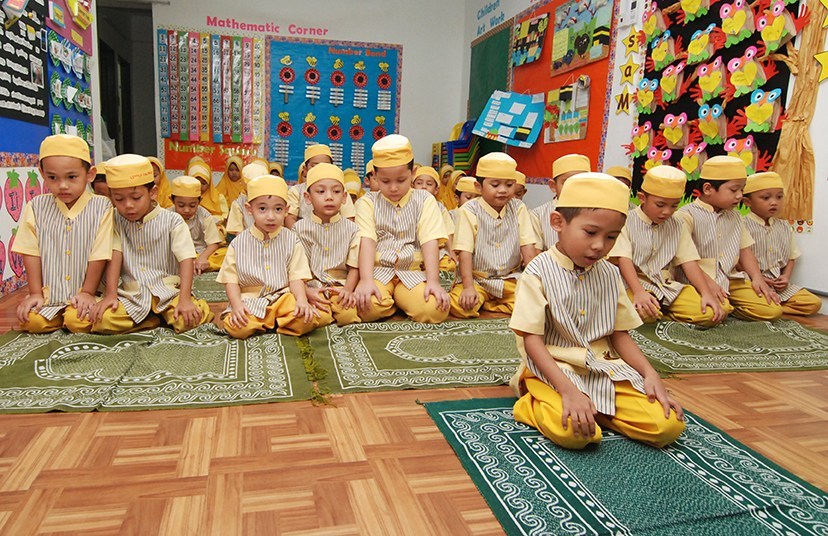 students praying together at school