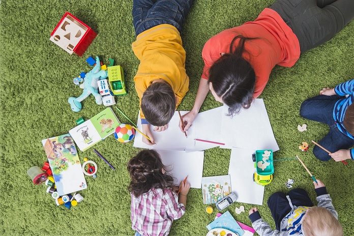 A group of children drawing and colouring