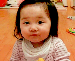 baby eating sweet potatoes