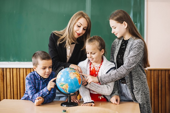 Kids and teachers with globe