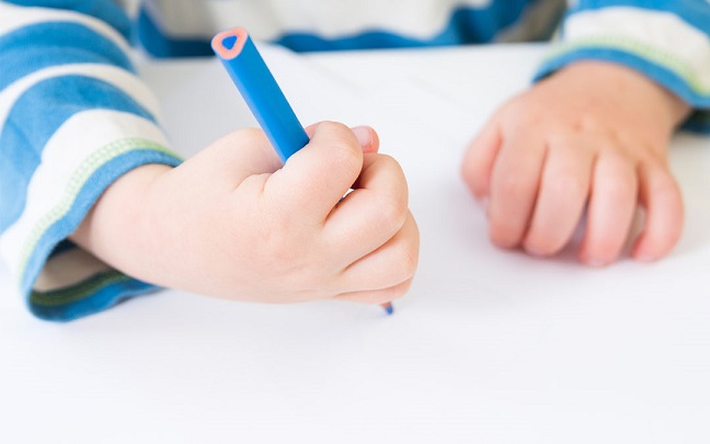 Awkward pencil gripping is normal for children below three, but if this persists until they are five years old, you might want to get it checked.